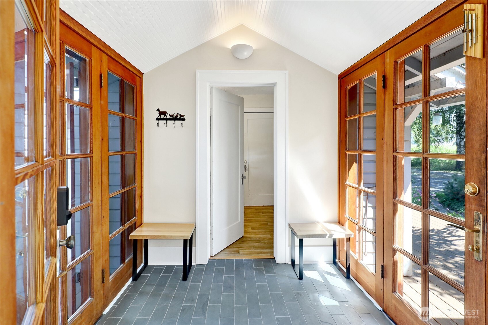 4749 Chuckanut Mountain Drive Bow, WA 98232 - Photo 25 of 40 a view of an entryway with wooden floor and windows
