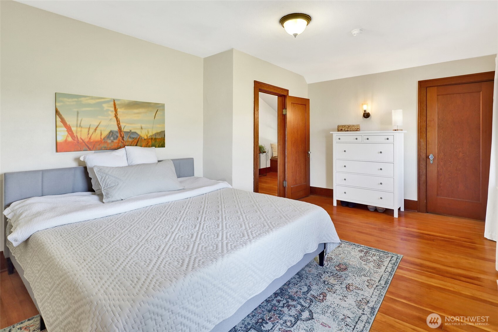 4749 Chuckanut Mountain Drive Bow, WA 98232 - Photo 30 of 40 a bedroom with a bed and a painting on the wall