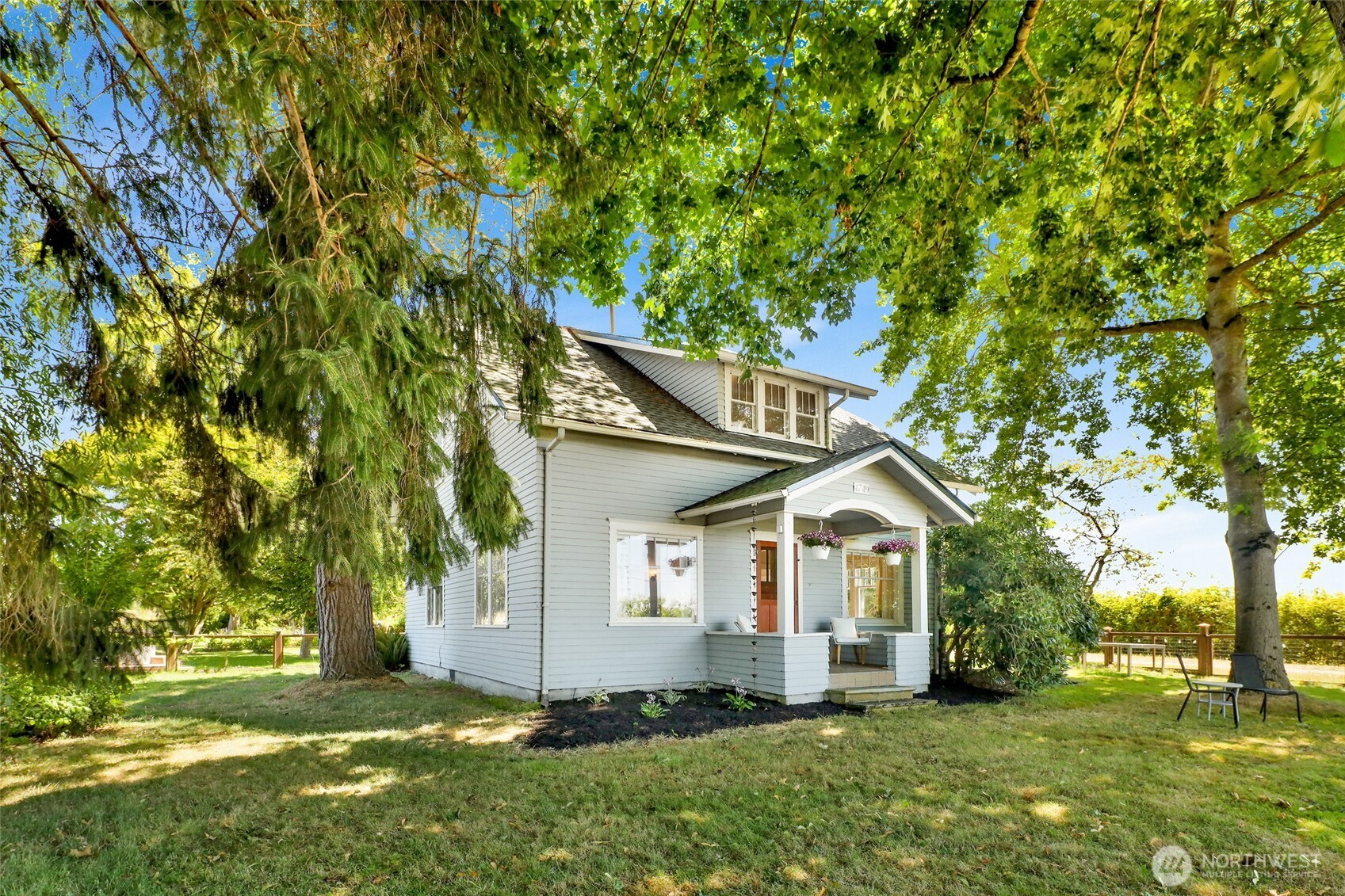 4749 Chuckanut Mountain Drive Bow, WA 98232 - Photo 34 of 40 a front view of a house with a yard