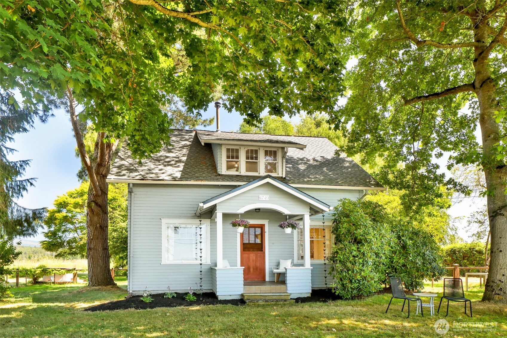 4749 Chuckanut Mountain Drive Bow, WA 98232 - Photo 35 of 40 a front view of a house with a garden
