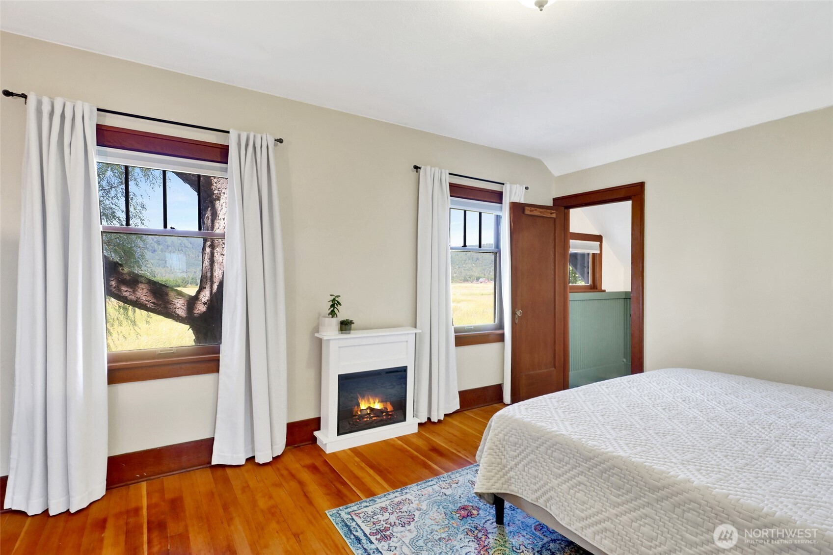 4749 Chuckanut Mountain Drive Bow, WA 98232 - Photo 6 of 40 a bedroom with a bed and a fireplace