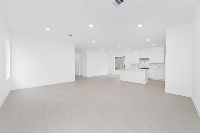 a view of kitchen and white cabinet