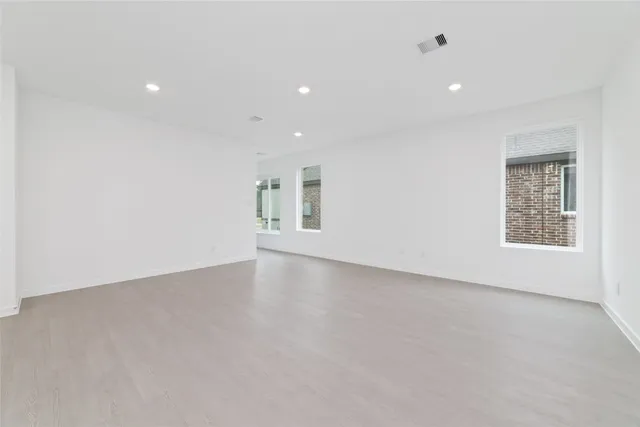 an empty room with a empty space and window