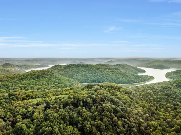 a view of a lake with a yard
