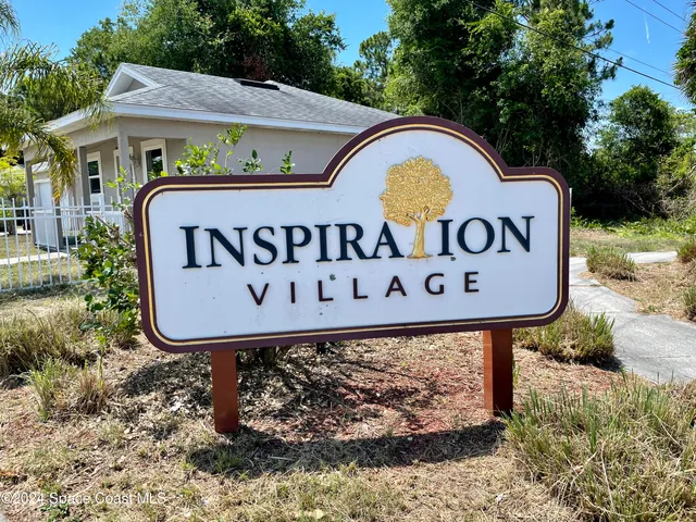 a sign broad on the side of the road