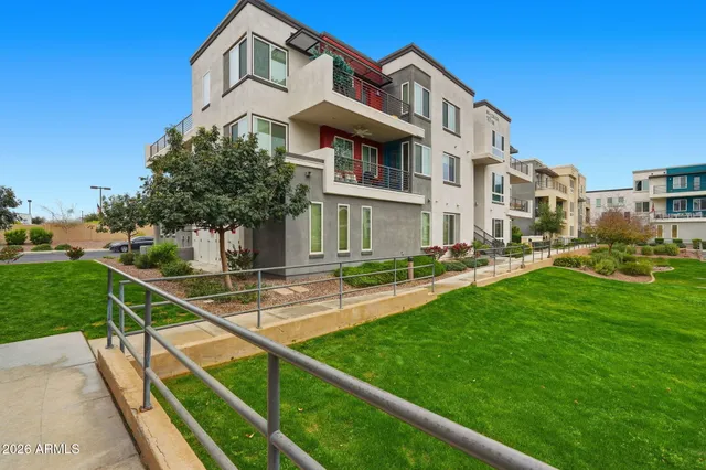 a front view of a house with yard and green space