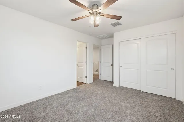 a view of a chandelier fan in a room