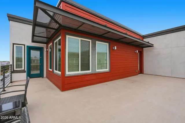 a view of a house with wooden fence