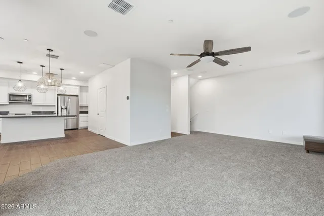 a view of a kitchen with a sink and cabinets