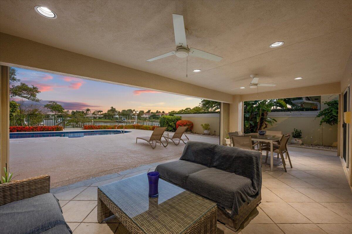 352 River Edge Road Jupiter, FL 33477 - Photo 42 of 56 a living room with furniture and a table