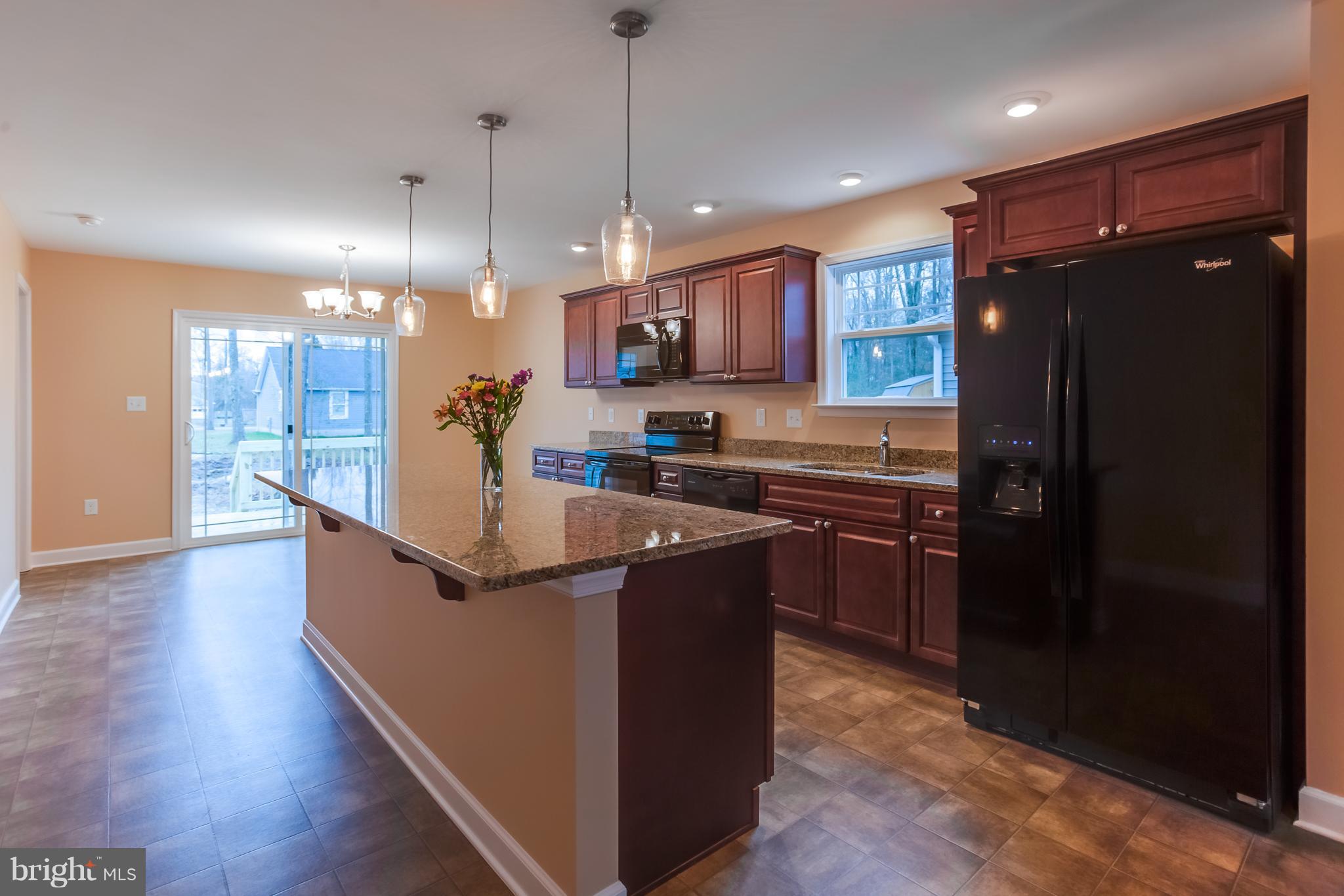 7th Street King George, VA 22485 - Photo 16 of 30 Kitchen- dinning area & back deck ..