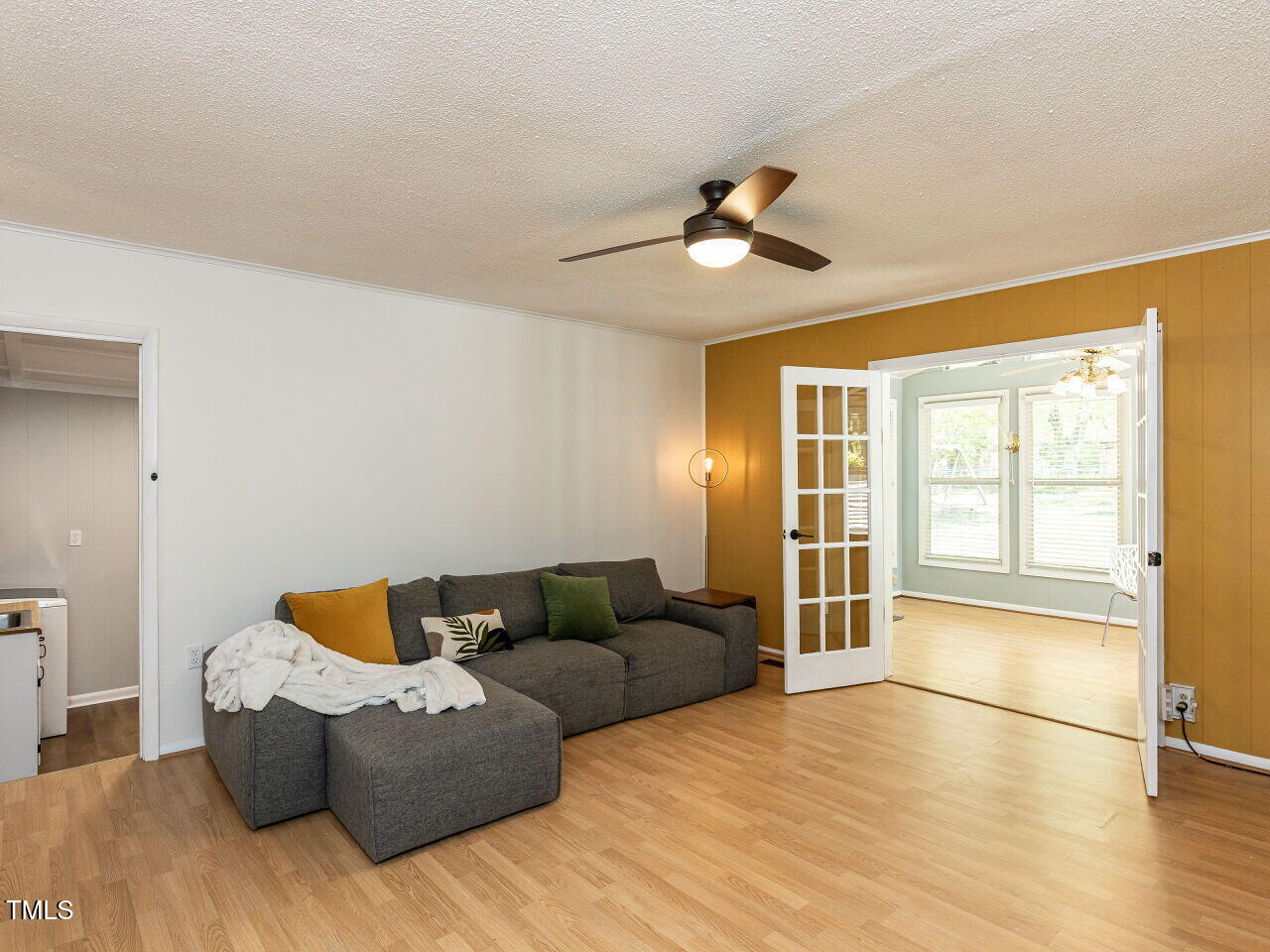 1317 Kelly Road Garner, NC 27529 - Photo 11 of 31 a living room with furniture and a large window