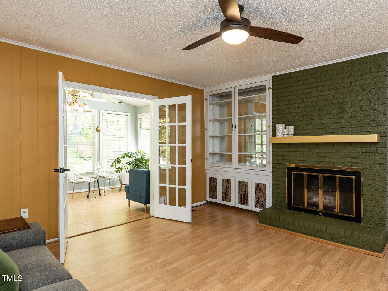 1317 Kelly Road Garner, NC 27529 - Photo 13 of 31 a view of a livingroom with wooden floor and a fireplace
