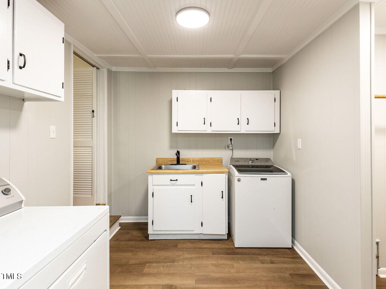 1317 Kelly Road Garner, NC 27529 - Photo 17 of 31 a room with a stove a sink and a refrigerator