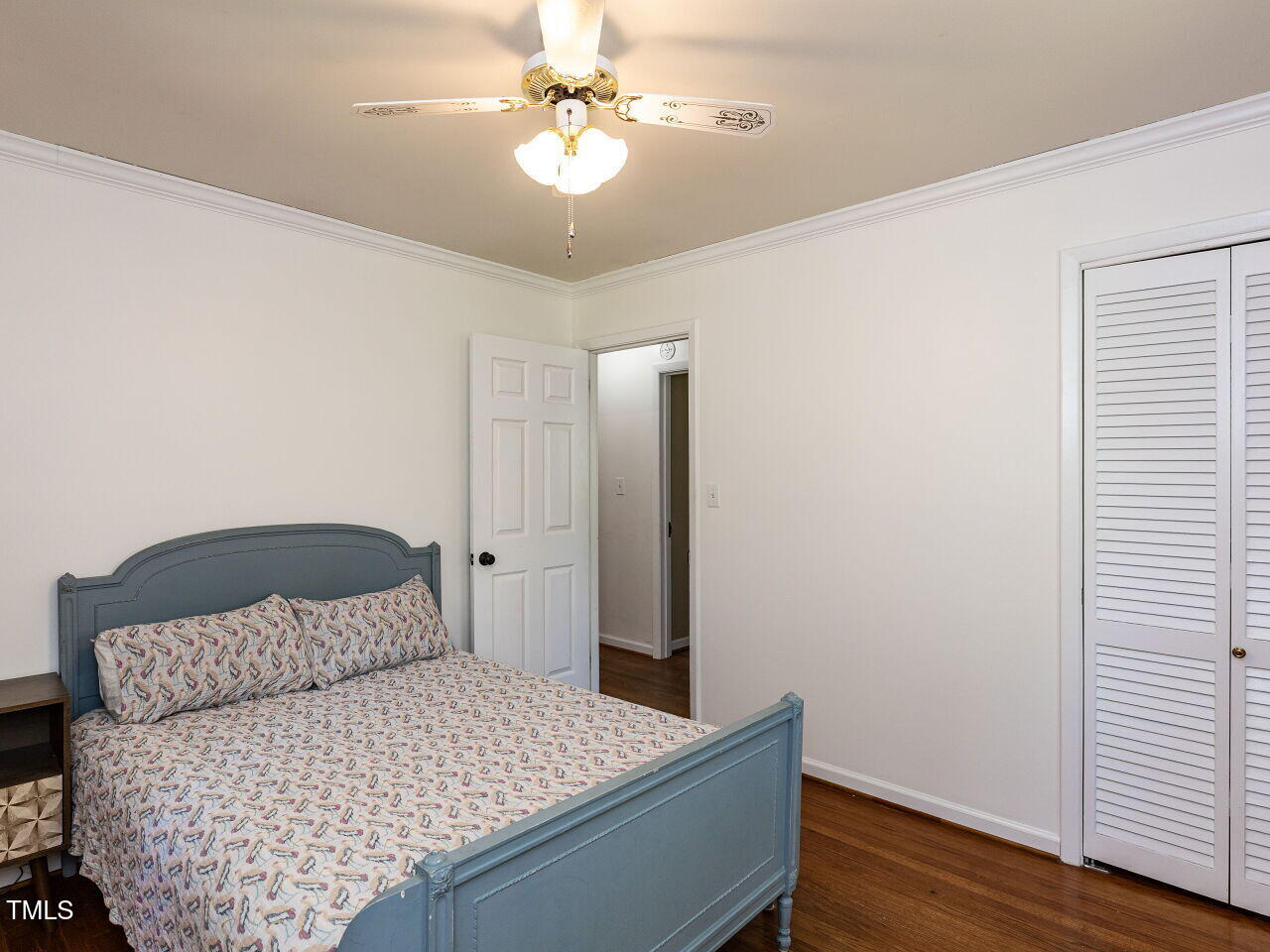 1317 Kelly Road Garner, NC 27529 - Photo 20 of 31 a bedroom with a bed and wooden floor