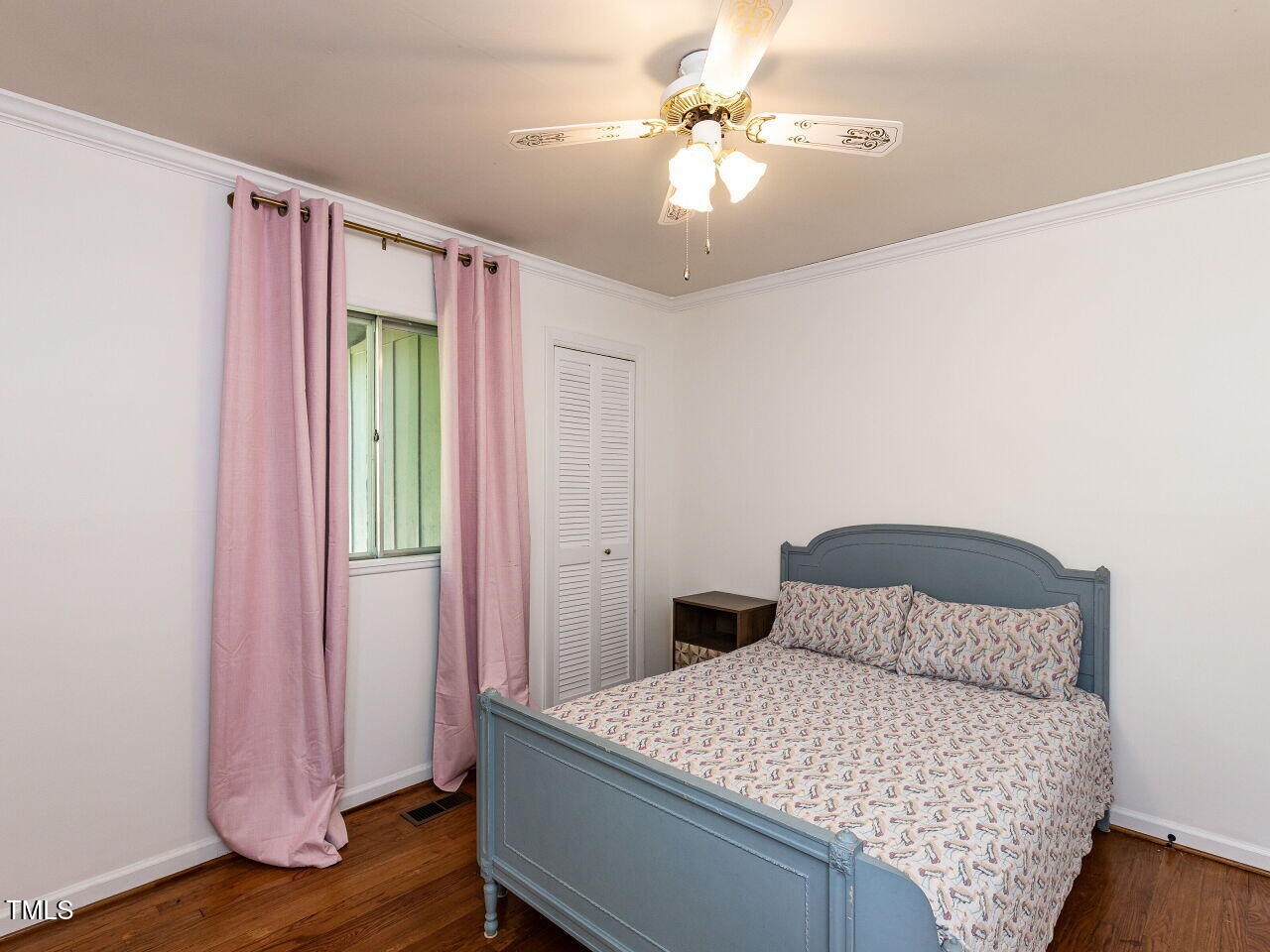 1317 Kelly Road Garner, NC 27529 - Photo 21 of 31 a bedroom with a bed dresser and a window