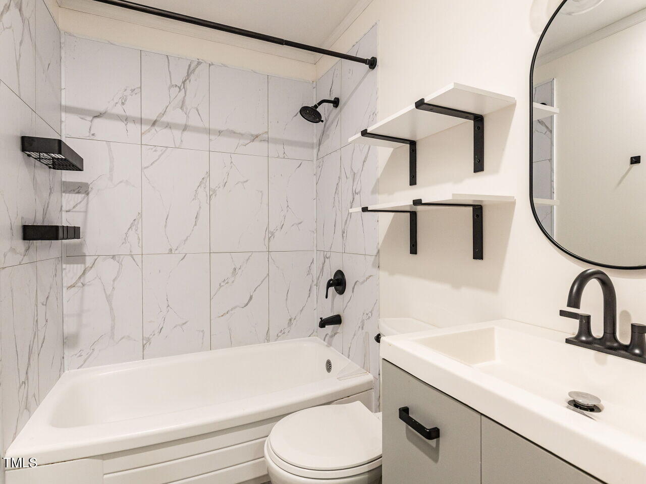 1317 Kelly Road Garner, NC 27529 - Photo 26 of 31 a bathroom with a sink toilet and shower