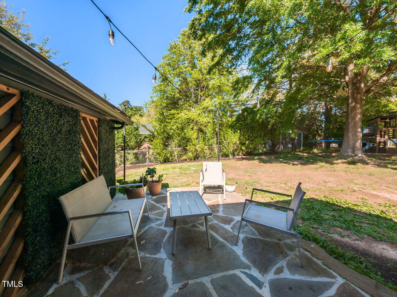 1317 Kelly Road Garner, NC 27529 - Photo 28 of 31 a view of backyard with outdoor seating and green space