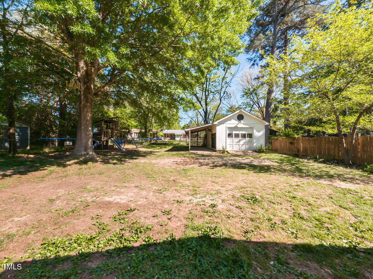 1317 Kelly Road Garner, NC 27529 - Photo 29 of 31 a house with trees in front of it