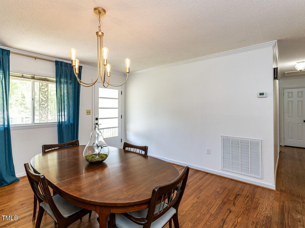 1317 Kelly Road Garner, NC 27529 - Photo 6 of 31 a view of a dining room with furniture window and wooden floor