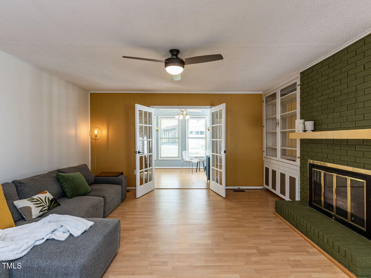 1317 Kelly Road Garner, NC 27529 - Photo 10 of 31 a living room with furniture and a wooden floor
