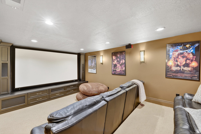 714 Draper Heights Way Draper, UT 84020 - Photo 48 of 88 Carpeted cinema room with a textured ceiling and recessed lighting