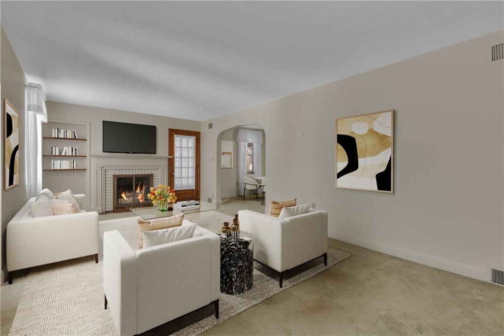 1543 2nd Street Beaver, PA 15009 - Photo 6 of 14 a living room with furniture a fireplace and a flat screen tv