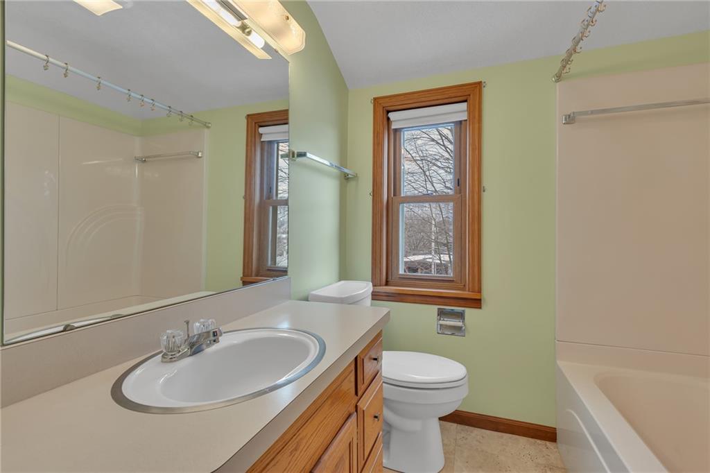 1543 2nd Street Beaver, PA 15009 - Photo 10 of 14 a bathroom with a sink a toilet and shower
