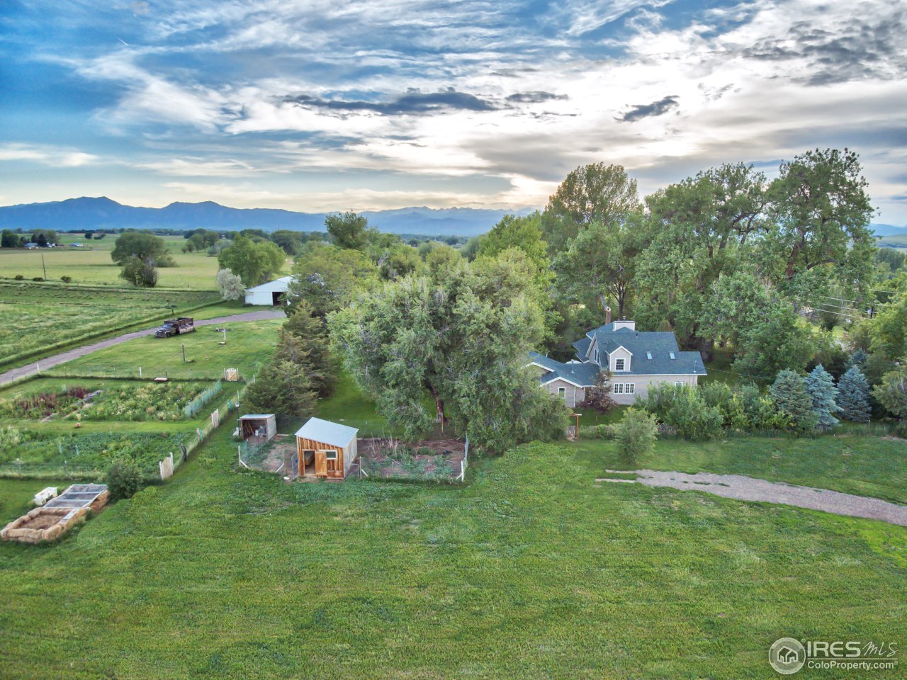 9760 Isabelle Road Lafayette, CO 80026 - Photo 1 of 40 a backyard of a house with table and chairs