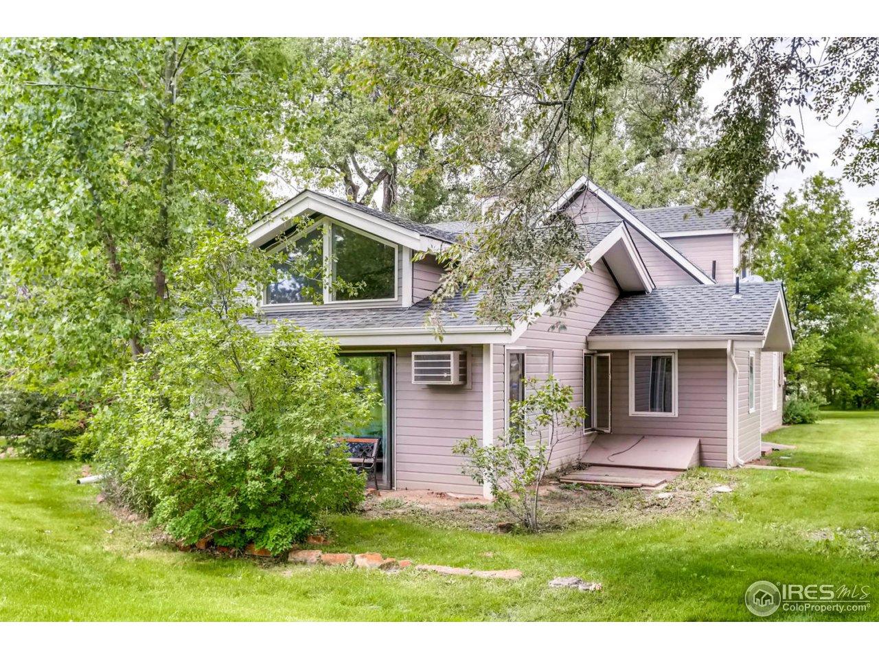 9760 Isabelle Road Lafayette, CO 80026 - Photo 22 of 40 a front view of a house with a yard