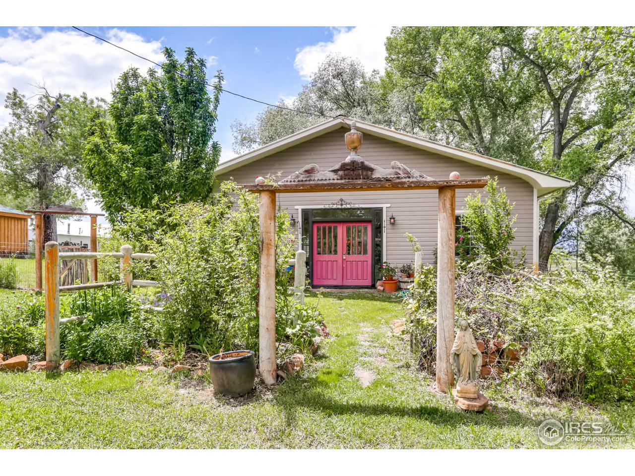 9760 Isabelle Road Lafayette, CO 80026 - Photo 25 of 40 a front view of a house with garden