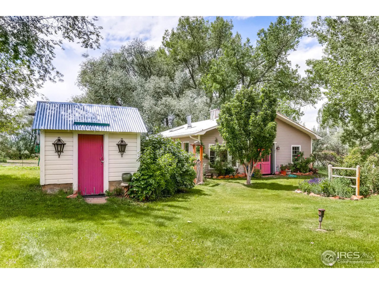 9760 Isabelle Road Lafayette, CO 80026 - Photo 26 of 40 a view of a house with a yard