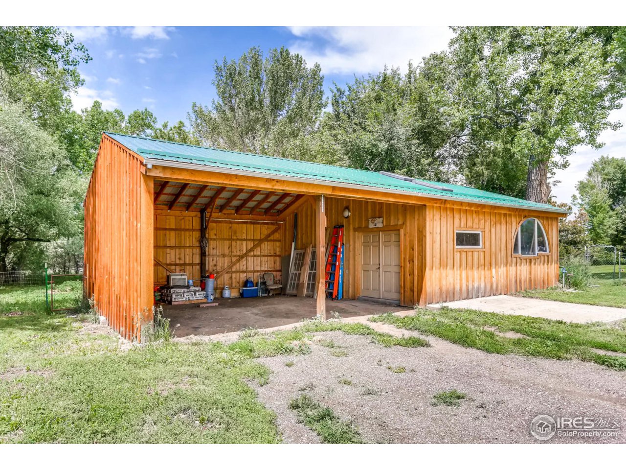 9760 Isabelle Road Lafayette, CO 80026 - Photo 29 of 40 a backyard of a house with barbeque oven