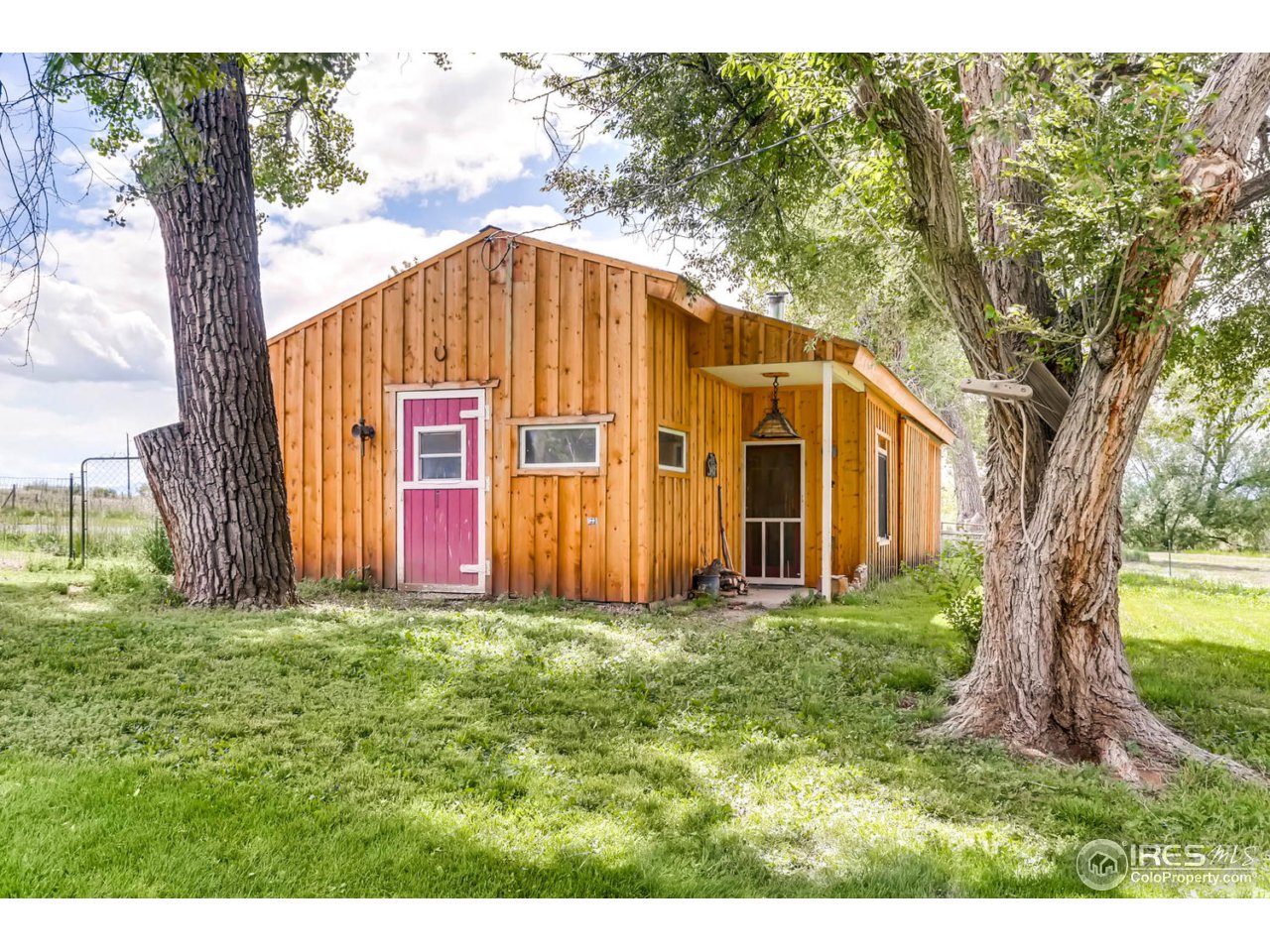 9760 Isabelle Road Lafayette, CO 80026 - Photo 31 of 40 a view of a house with a yard