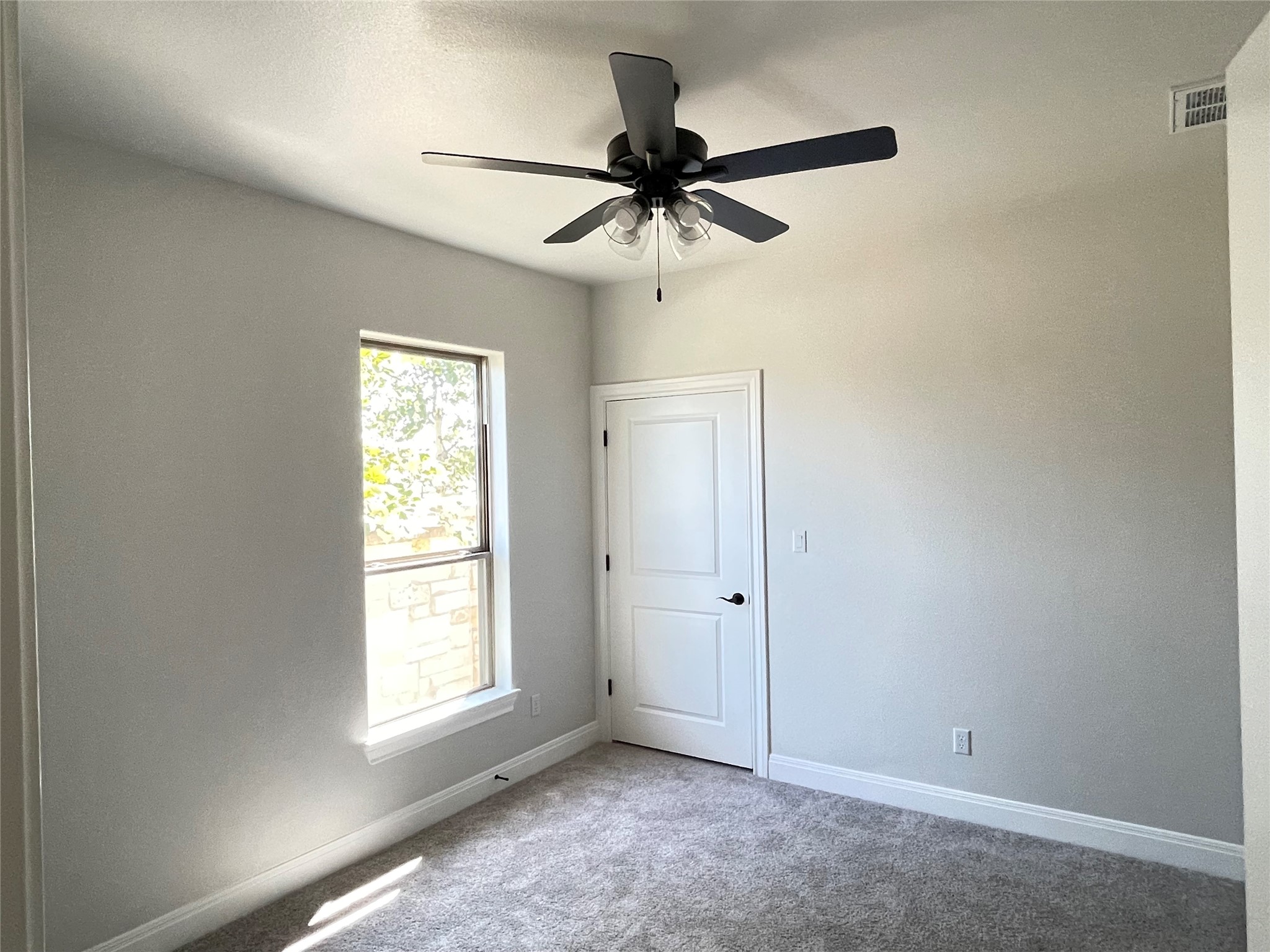 104 Creek Point Drive Georgetown, TX 78628 - Photo 12 of 18 an empty room with a window and a fan
