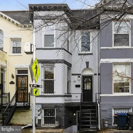 a view of a building with a street