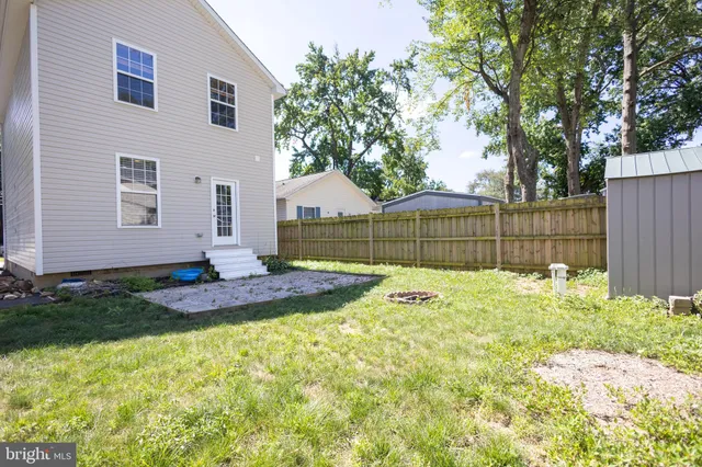 a view of backyard with house and green space