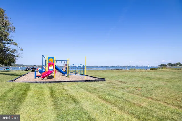 a view of a swimming pool with a yard
