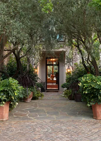 a front view of a house with garden