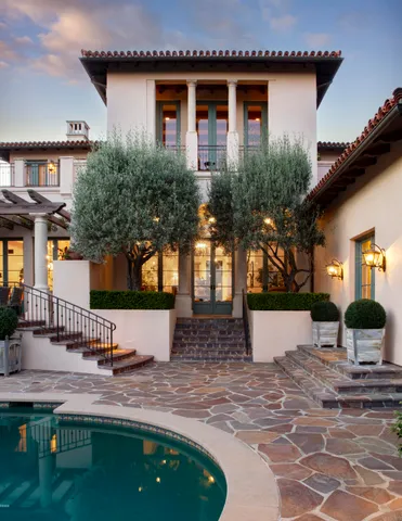 a view of a swimming pool with an outdoor space and seating area