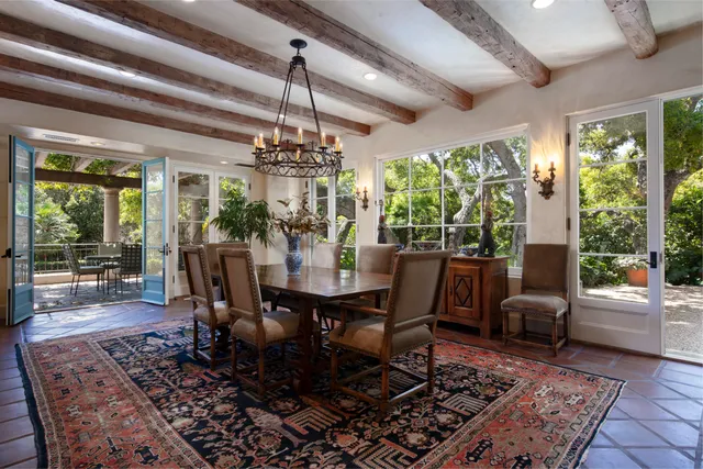 a view of a dining room with furniture wooden floor and chandelier