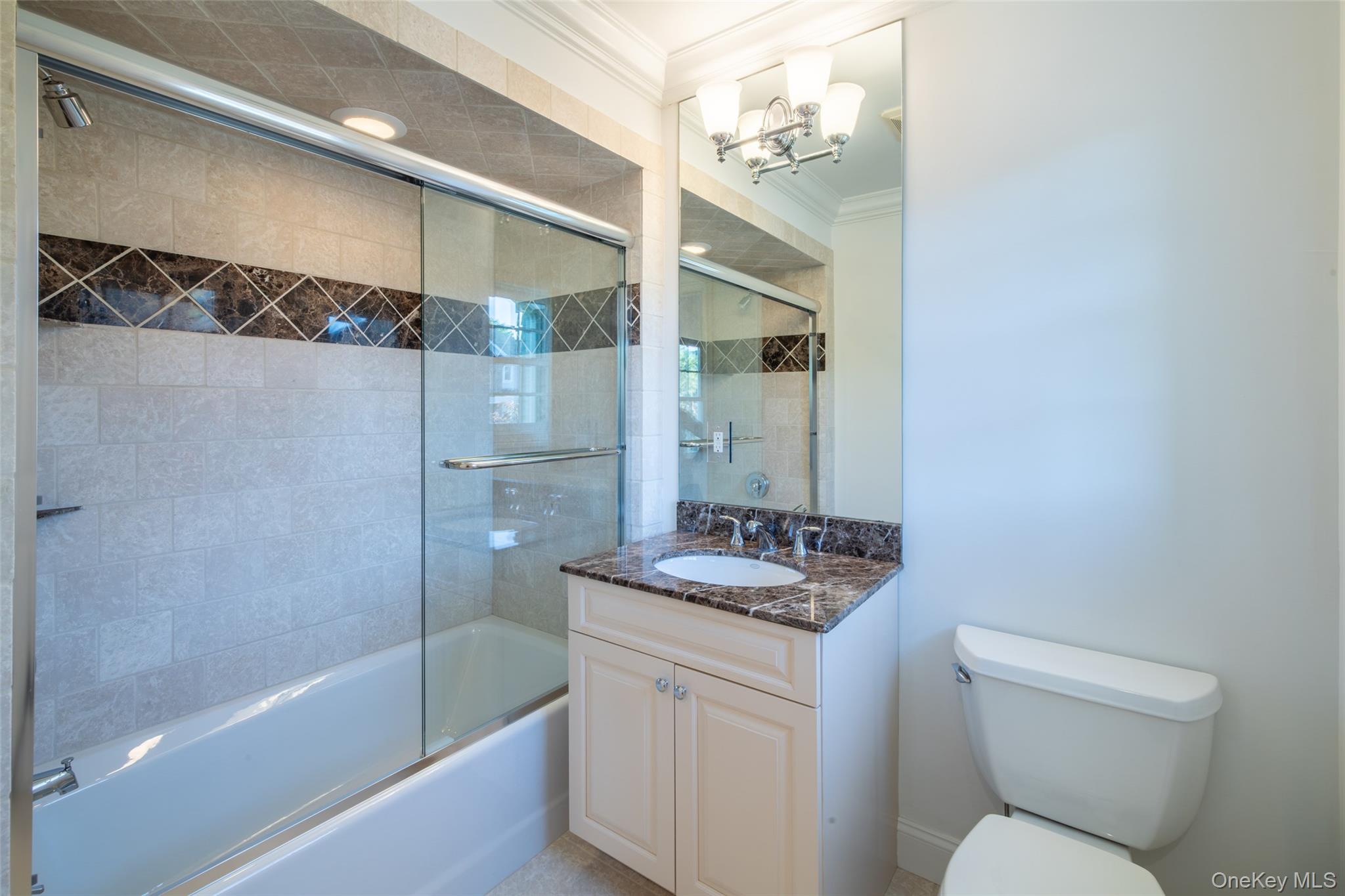 1 Mill Pond Lane New Rochelle, NY 10805 - Photo 21 of 38 a bathroom with a granite countertop sink toilet and shower