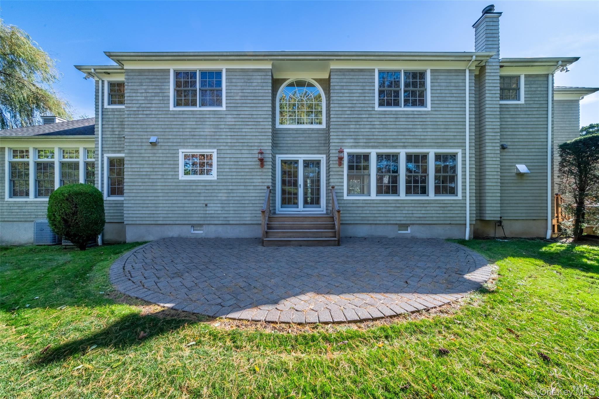 1 Mill Pond Lane New Rochelle, NY 10805 - Photo 33 of 38 a front view of a house with garden