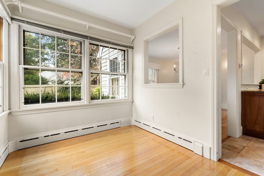 22 Arrowhead Road Marblehead, MA 01945 - Photo 12 of 34 an empty room with a window and wooden floor