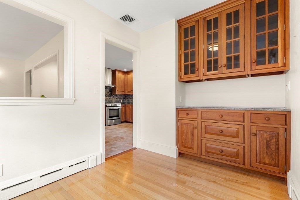 22 Arrowhead Road Marblehead, MA 01945 - Photo 13 of 34 view of kitchen with granite countertop cabinets and wooden floor