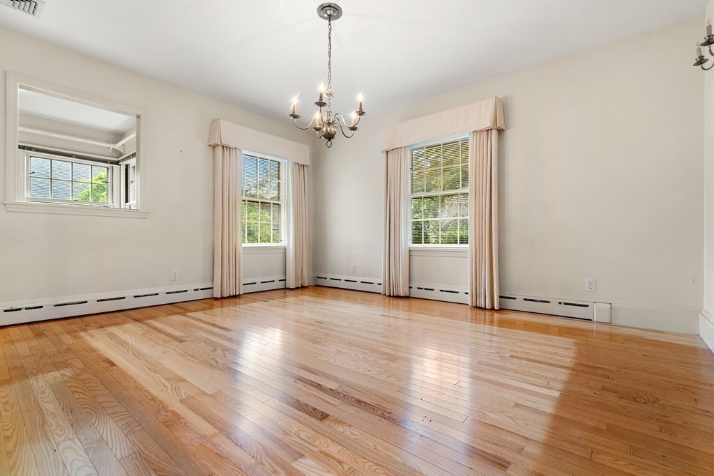 22 Arrowhead Road Marblehead, MA 01945 - Photo 14 of 34 a view of an empty room with wooden floor and a window