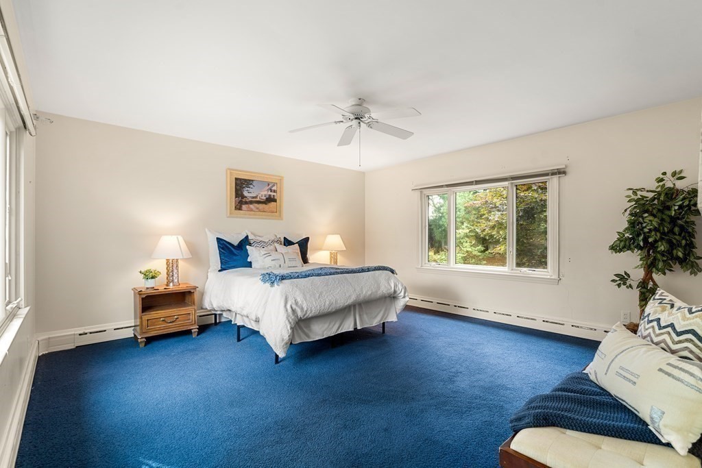 22 Arrowhead Road Marblehead, MA 01945 - Photo 17 of 34 a bedroom with a bed and a couch