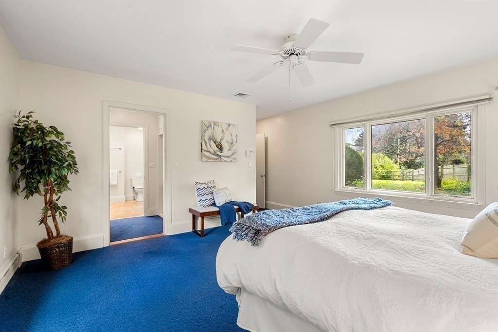 22 Arrowhead Road Marblehead, MA 01945 - Photo 18 of 34 a bed sitting in a spacious bedroom next to a window