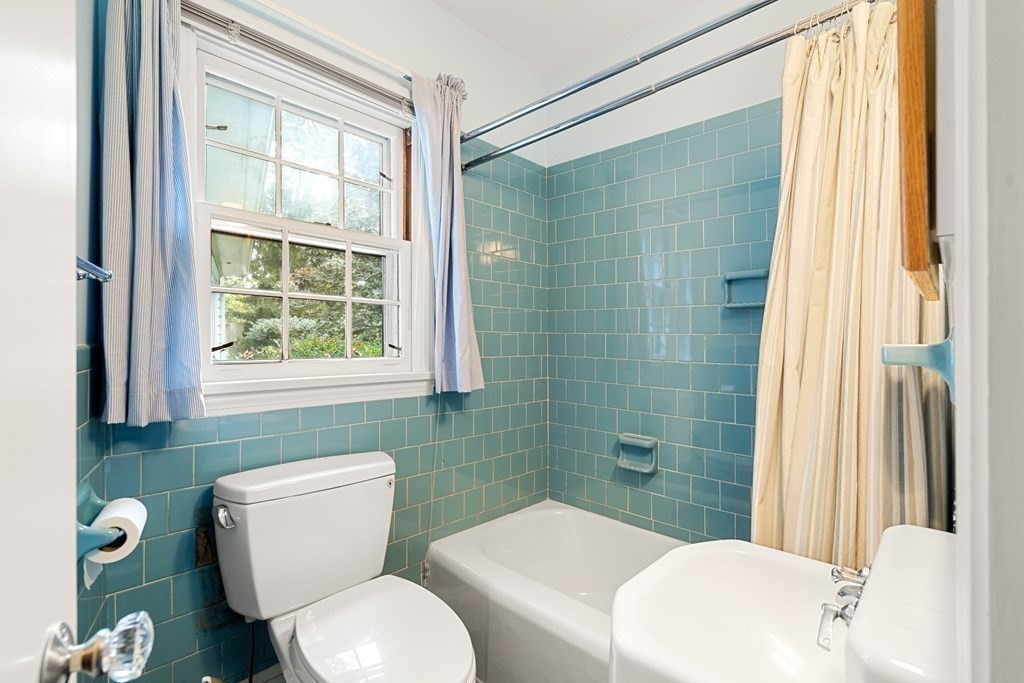 22 Arrowhead Road Marblehead, MA 01945 - Photo 22 of 34 a bathroom with a toilet a sink and a shower