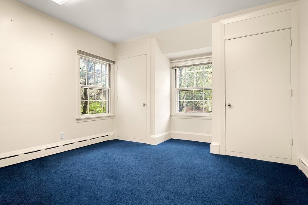 22 Arrowhead Road Marblehead, MA 01945 - Photo 23 of 34 an empty room with wooden floor and windows